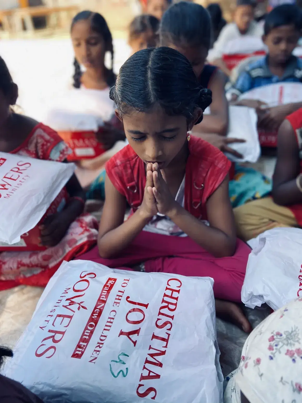 Children receiving Christmas Joy gifts
